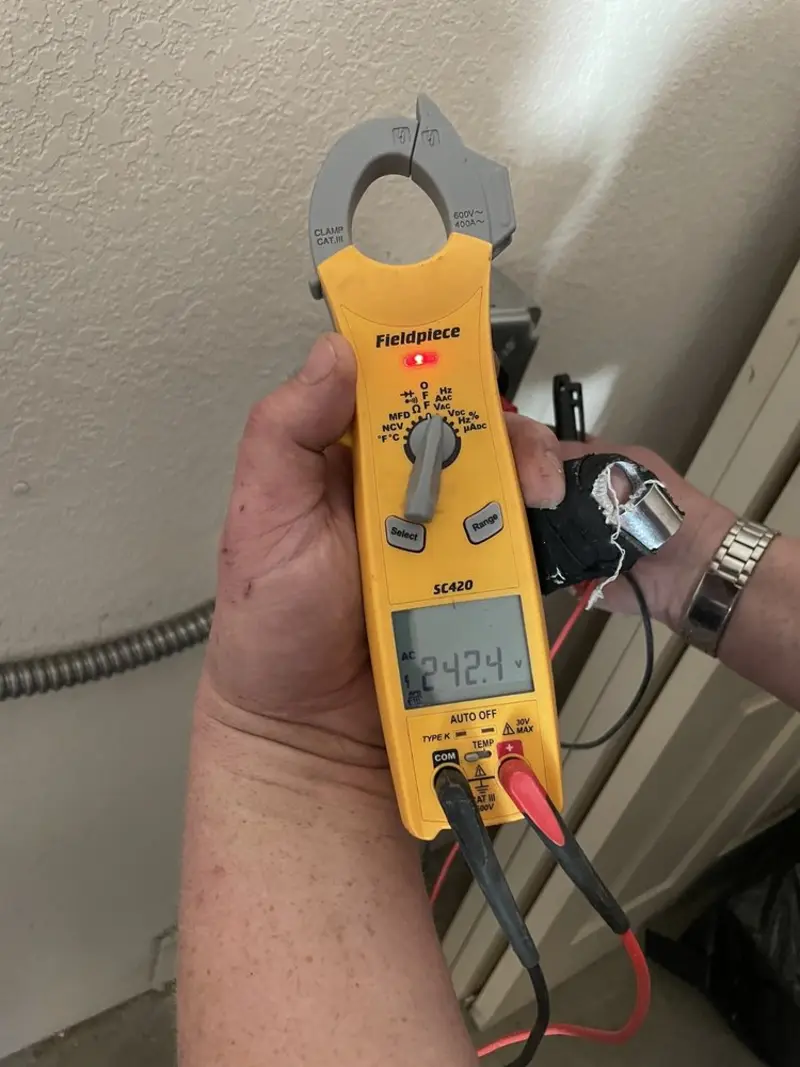 Voltage testing with clamp meter during Ceiling Fan Installation in Parma